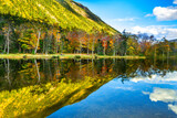 Fototapeta Do pokoju - Fall foliage reflects in Willey House Dam pond, Crawford Notch State Park, New Hampshire.