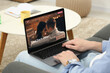 Looking for partner. Man using laptop at home, closeup. Dating site webpage on device screen