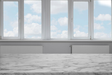 Wall Mural - Empty white marble table against window indoors. Space for design