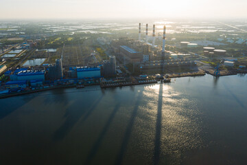 Wall Mural - Aerial view Bang Pakong power plant of gas power plant, Thermal power plants and fuel oil, electrical power plant. energy concept, morning sky, container ship, freight transportation,