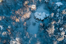 Aerial View Of An Old Manor House Hidden Among A Fabulous Snow-covered Forest In Winter. The Turliki Estate Of 1901 - Dacha Morozovoy. Obninsk, Russia