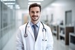 © kimly - portrait of smiling doctor with blur hospital background