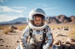 9 year old boy in astronaut costume explores desert