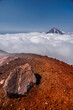 Kamchatka volcanic landscape: view to top of cone of Koryaksky Volcano from scenery active crater of Avacha Volcano on sunny day and blue sky. Russian Far East