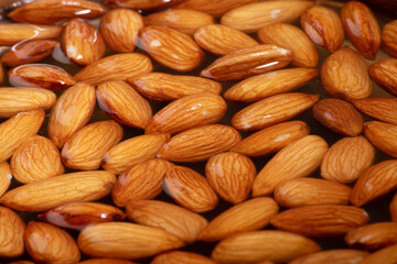 Wall Mural - Closeup of soaked almonds texture background