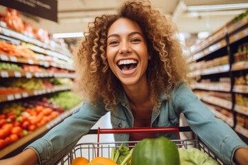 A cheerful and smiling woman customer pushing a shopping cart filled with fresh groceries down the supermarket aisle, the joy of products shopping.