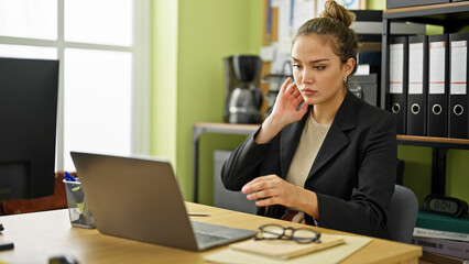 Canvas Print - Young beautiful hispanic woman business worker using laptop working at office