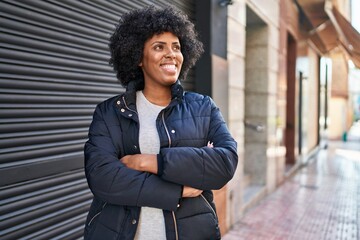 Sticker - African american woman standing with arms crossed gesture at street