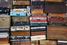 Stack Of Colorful Vintage Suitcases. Retro Decorative Suitcases, New Vacation Plans And Journeys. Old Style Suitcases Stacked On Top Of Each Other