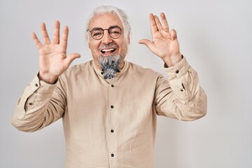 Canvas Print - Middle age man with grey hair standing over isolated background showing and pointing up with fingers number nine while smiling confident and happy.