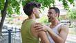 © Krakenimages.com - Two men couple smiling confident hugging each other at park