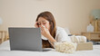 © Krakenimages.com - Young beautiful hispanic woman watching drama movie lying on bed crying at bedroom