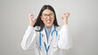 © Krakenimages.com - Young hispanic woman doctor angry and stressed over isolated white background