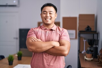 Sticker - Young chinese man business worker smiling confident standing with arms crossed gesture at office