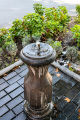 Sticker - water bubbler with drinking water on street of Yerevan city in autumn day