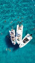 Wall Mural - Aerial view of boats in the turquoise sea of Sardinia, Italy 