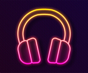 Canvas Print - Glowing neon line Headphones icon isolated on black background. Earphones. Concept for listening to music, service, communication and operator. Vector