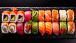 Japanese sushi food. Maki and rolls with tuna, salmon, shrimp, crab and avocado. Top view of various sushi