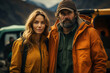 © Georgii - Portrait of happy couple in touristic outwear near the tent camp against the backdrop of picturesque mountain landscape. Caucasian family is engaged in a mountain hiking. Tourism and active lifestyle.
