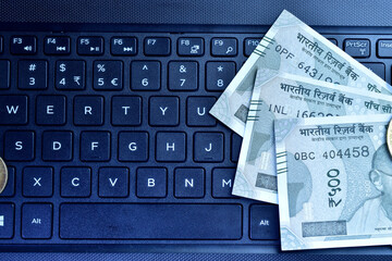 Wall Mural - Top view of indian currency note with keyboard