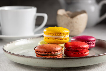 Wall Mural - Delicious macaroons on the table. Macarons cakes in different colors.