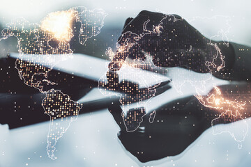 double exposure of abstract digital world map and finger clicks on a digital tablet on background, r