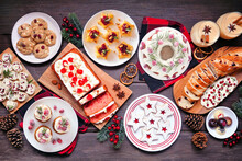 Christmas Food Table Scene. Overhead View On A Dark Wood Background. Group Of Appetizers And Delicious Sweets. Copy Space. Holiday Party Food Concept.