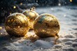 three shiny golden christmas ornaments sit in the snow near sparkling balls