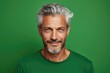 © Andrii Zastrozhnov - A cheerful and stylish middle-aged Caucasian man with a confident smile, exuding positivity and success in a portrait.
