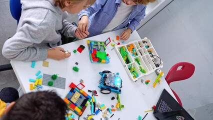 Wall Mural - robotics programming class. children construct and code robot. stem education using constructor bloc