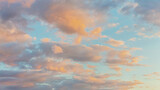 Fototapeta Natura - Panoramic view of clear blue sky and multicolored clouds, Blue sky background with tiny clouds. White and pearl fluffy clouds in the blue sky at sunrise. Atmosphere background or wallpaper