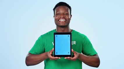 Canvas Print - Man, volunteering and tablet mockup or screen for website, presentation or donation information in studio. Face of African person or NGO speaker for digital space, tracking marker and blue background