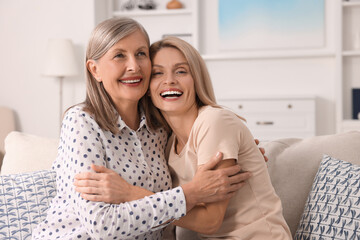 Canvas Print - Happy mature mother and her daughter at home