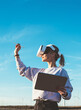 © BullRun - Female in VR goggles creating digital space