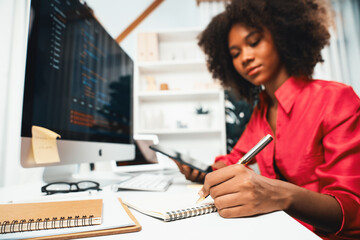 young working african woman creating coding website developer, thinking data information designer at