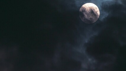 Wall Mural - atmospheric video with full moon and clouds. close-up. mystical and atmospheric content. time lapse 