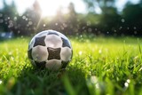 Fototapeta Sport - Traditional soccer ball resting on grass. Generative AI