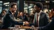 Two happy mature business men shaking hands in office. Successful african american businessman in formal clothing closing deal with handshake. Multiethnic businessmen shaking hands during a meeting.