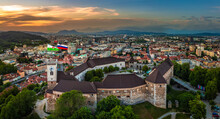 Ljubljana, Slovenia - Aerial Panoramic View Of Ljubljana Castle On A Summer Afternoon With Franciscan Church Of The Annunciation, Ljubljana Cathedral And Skyline Of The Capital Of Slovenia At Sunset