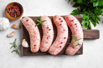 Wall Mural - Raw sausages with spices and rosemary