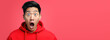Portrait of surprised asian man on bright colors studio backgroud with copyspace, excitement and fascination, shocked and amazed male with unexpected thing happen