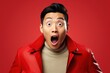 Portrait of surprised asian man on bright colors studio backgroud, excitement and fascination, shocked and amazed male with unexpected thing happen