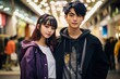 Young asian man and woman wear street fashion in city background.