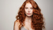 © Malambo/Peopleimages - AI - Portrait of young woman with long wavy ginger hair. Hair care, make-up and hair health