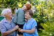 © Westend61 - Grandparents spending leisure time with grandson in garden