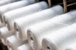 close-up shot of white cotton threads on a spinning mill