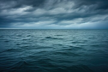 Canvas Print - ocean surface under a grey cloud