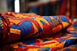 vibrantly patterned african fabric wrapped on a dummy