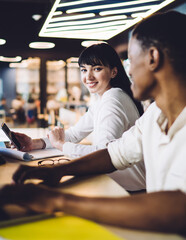 Poster - Cheerful colleagues with devices during business meeting