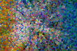 Scattered colourful atomic spots, gradually turning from yellow to blue